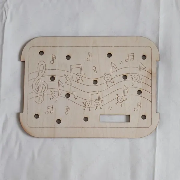 Insert Trofast en bois avec portée musicale et notes souriantes thème musique