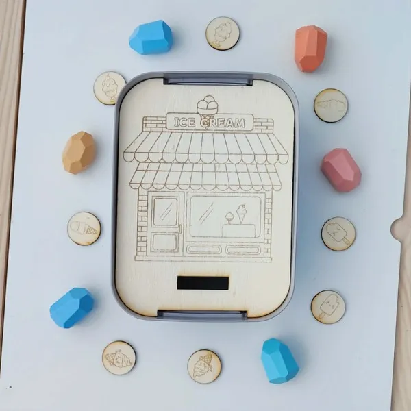 Insert Livv 2L représentant un glacier avec jetons illustrés de différentes glaces à associer.