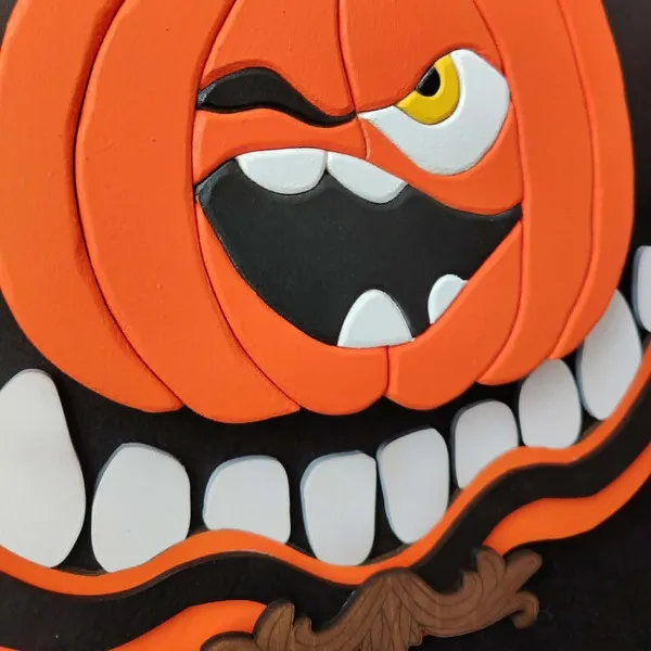 Détail du visage de la citrouille du cadre décoratif Croc’Citrouille